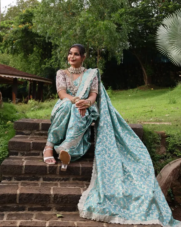 A beautiful pastel blue Nauvari with a silver floral pattern, offering a modern and refreshing take on the traditional attire.