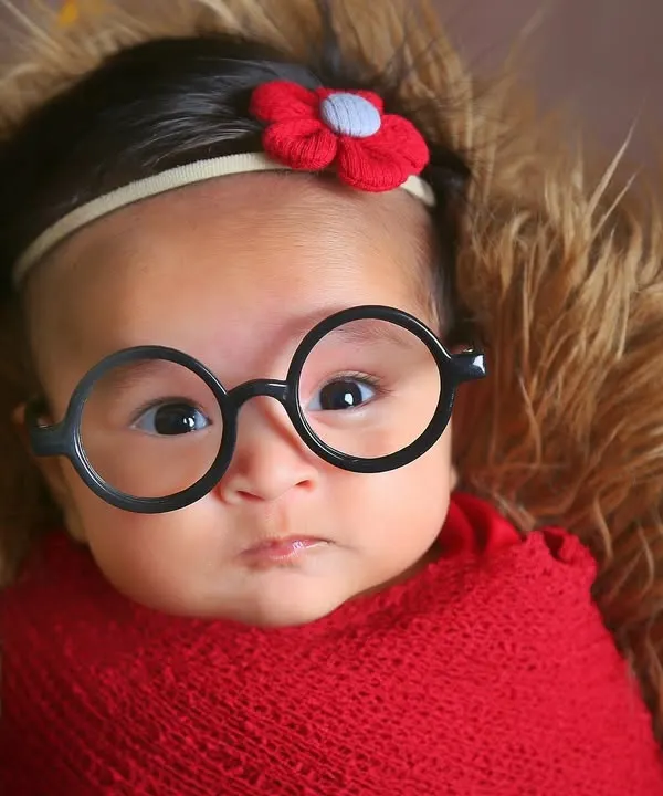 For the family of Harry Potter fans, we had to add a touch of magic. A simple pair of round glasses on this alert little wizard-in-training created a playful and memorable portrait.