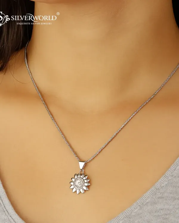 Shine bright every day with the timeless elegance of our Sunburst Pendant. This beautiful piece, crafted in 925 sterling silver with a Zirconia center, is for those who love to glow effortlessly.