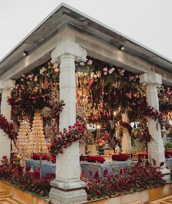 For this traditional Bunt ceremony, we used a rich, deep red floral palette to create a dramatic and opulent mandap against the backdrop of the Nandi Hills. The structure was designed to feel both grand and deeply rooted in tradition.