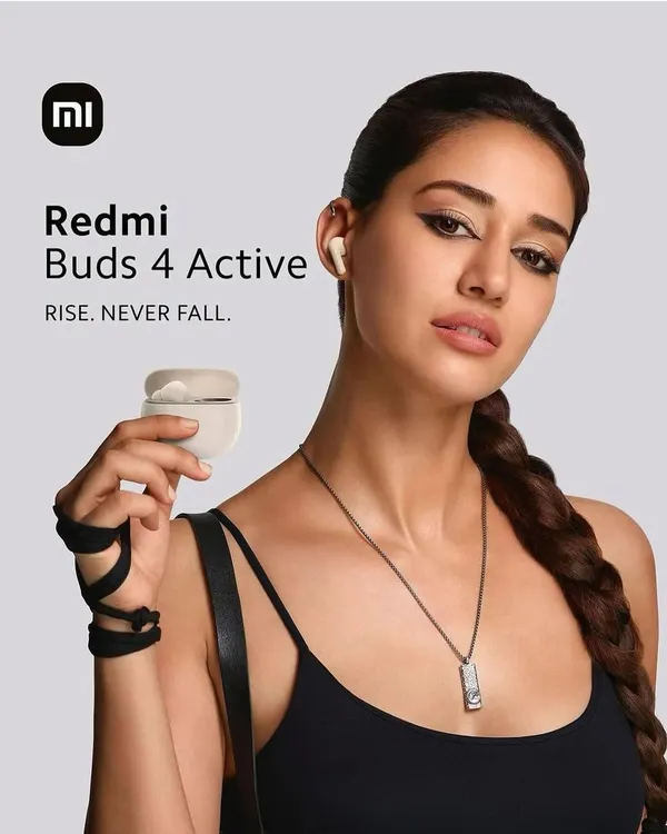 The official campaign image for Redmi Buds 4 Active with Disha Patani. I created a sharp, edgy makeup look with a winged eyeliner to match the 'Rise. Never Fall.' tagline.