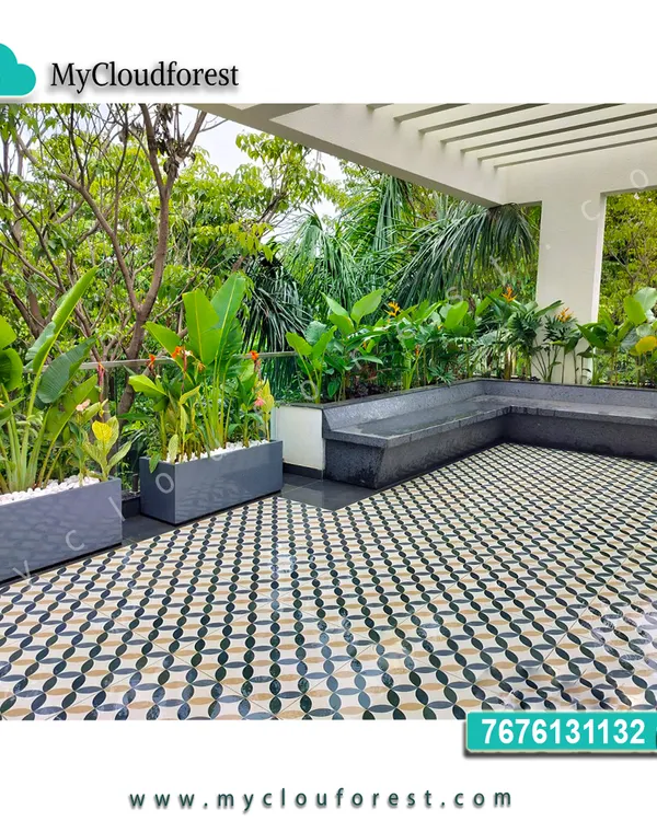 This terrace features a built-in L-shaped bench and modern planters filled with tropical foliage. The patterned tile floor adds a decorative touch, creating a stylish and comfortable outdoor lounge area.