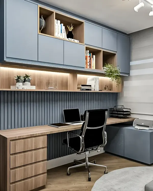 This home office design features a cool blue and wood color scheme. We included a mix of open and closed overhead cabinets and a spacious L-shaped desk to create a highly organized and inspiring workspace.