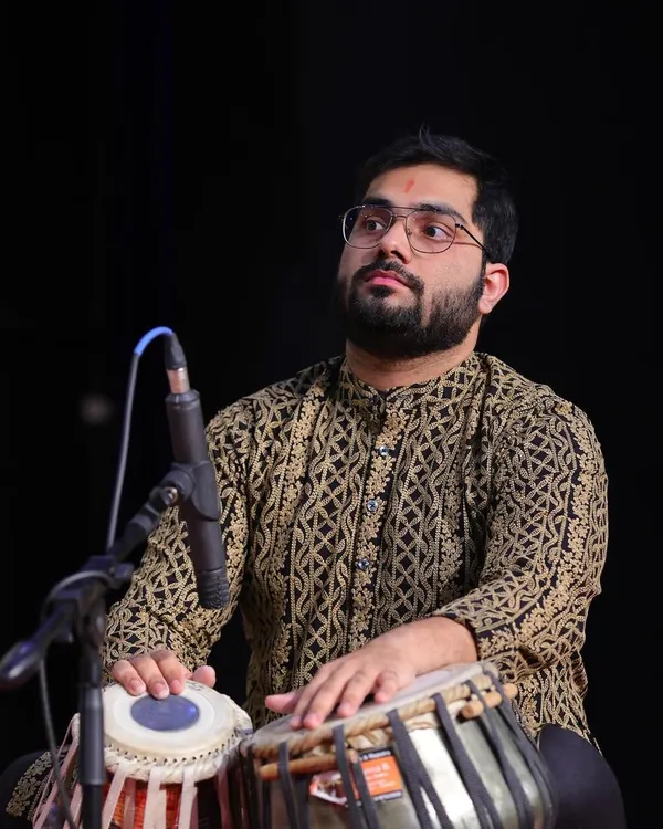 A moment of deep concentration during a live tabla performance. When I play, it feels like speaking a language without words, a sentiment beautifully expressed by the great Anindo Chatterjee.