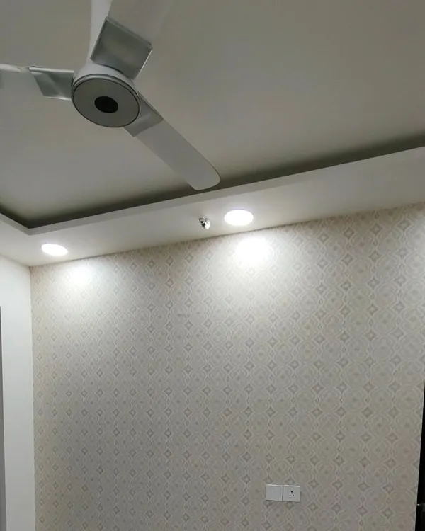 A simple, small-patterned wallpaper that adds subtle texture and elegance to a room.