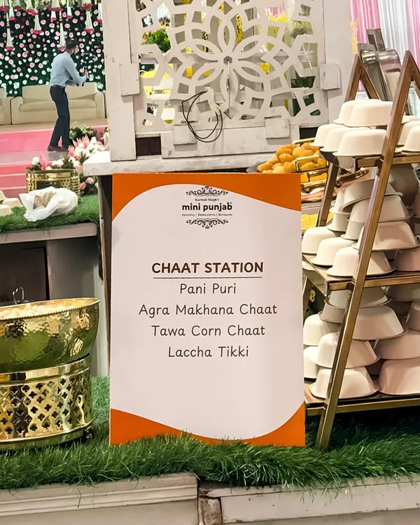 Our dedicated Chaat Station, with a clear menu listing favourites like Pani Puri, Agra Makhana Chaat, and Laccha Tikki. The elegant setup with golden serveware elevates this street food experience.