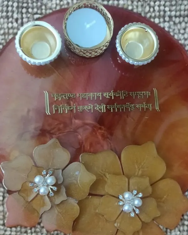 I love making these custom pooja thalis. This one has a beautiful Ganesh mantra embedded in the resin, complemented by large 3D flowers and holders for your pooja essentials.
