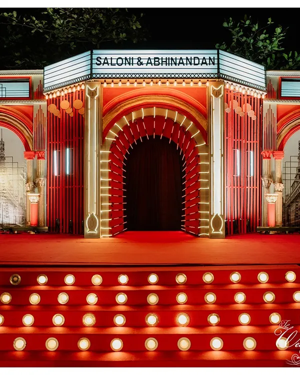 For this Sangeet, we created a grand Bollywood theatre entrance. The red carpet and marquee lights set the stage for a night of cinematic celebration.