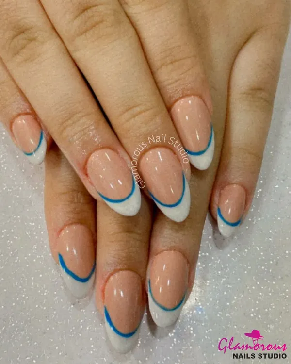 We believe even classics can have a modern twist. Here, we've updated the timeless French manicure with a clean white tip and a sharp, electric blue line for a look that is chic, clean, and totally unique. It's a perfect example of minimalist design with maximum impact.