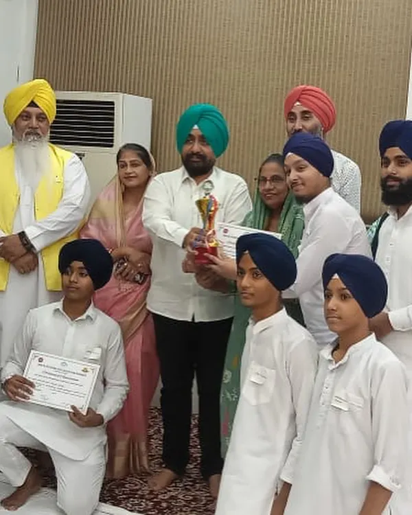Our students and teachers celebrating a first prize win at a kirtan competition held at Mata Sundri College.