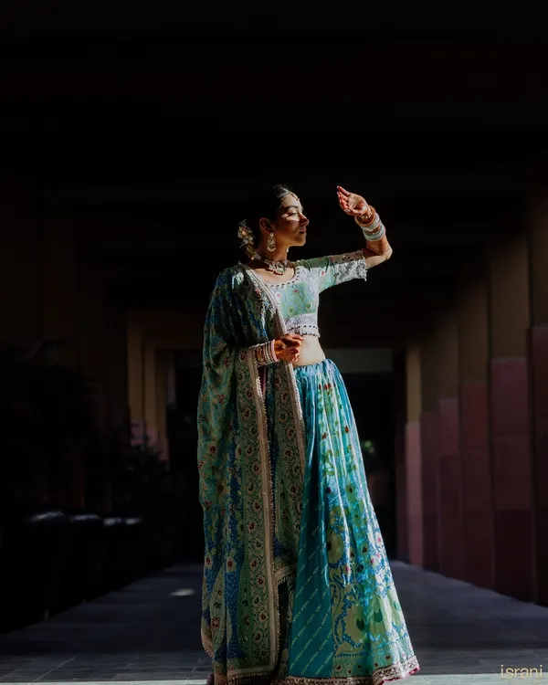 A moment of quiet reflection for the bride. We love this artistic shot, using light and shadow to create a beautiful, soulful portrait before the festivities begin.