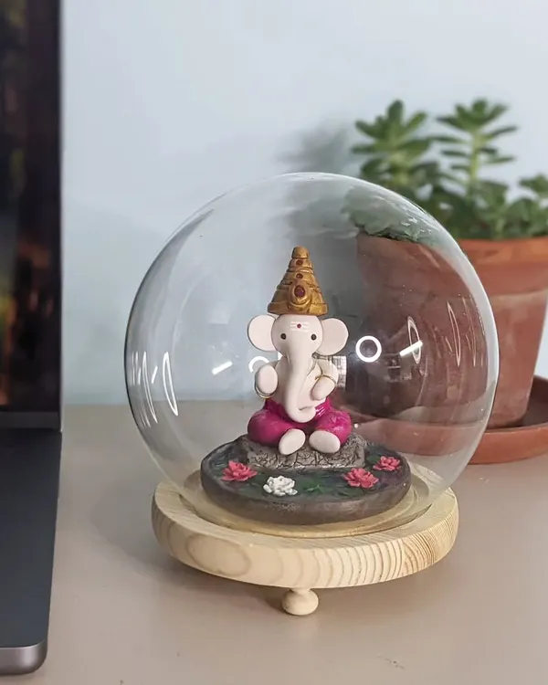 Celebrate Ganesh Chaturthi with a handmade polymer clay Ganesha idol. This one sits in a glass dome on my desk, bringing peace and charm to my workspace.