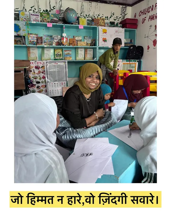 This picture was taken during a workshop, surrounded by my wonderful students. The quote, "Jo himmat na hare, vo zindagi savare," means the one who doesn't lose courage, makes their life better.
