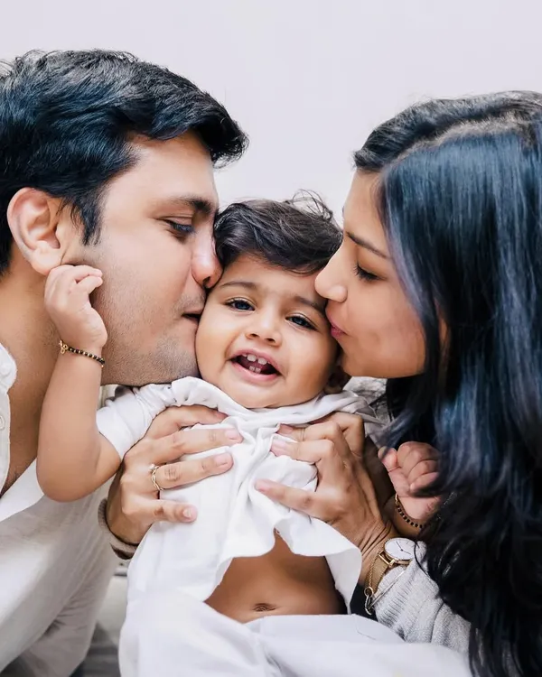 There is so much love in this one frame. A home session allows for these incredibly intimate moments where a baby is showered with affection from both parents. This is the warmth I aim to capture.