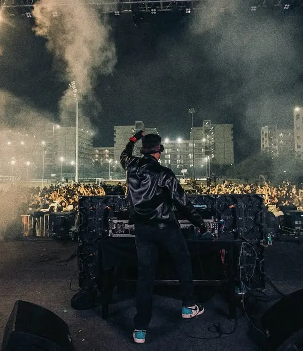Overlooking a massive crowd at a university festival, surrounded by smoke effects. This is the view from my office, where I create an epic atmosphere for thousands of students.