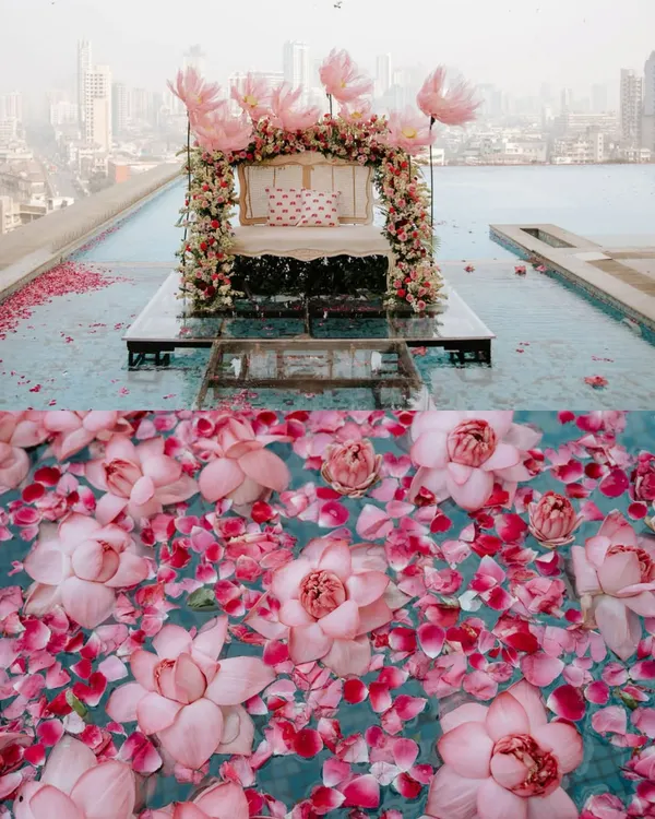 A breathtaking mehendi setup where dreams float on water. We designed this magical stage with giant organza lotuses and lush florals, creating an ethereal 'Bagh-e-Ishq' (Garden of Love) against the city skyline.