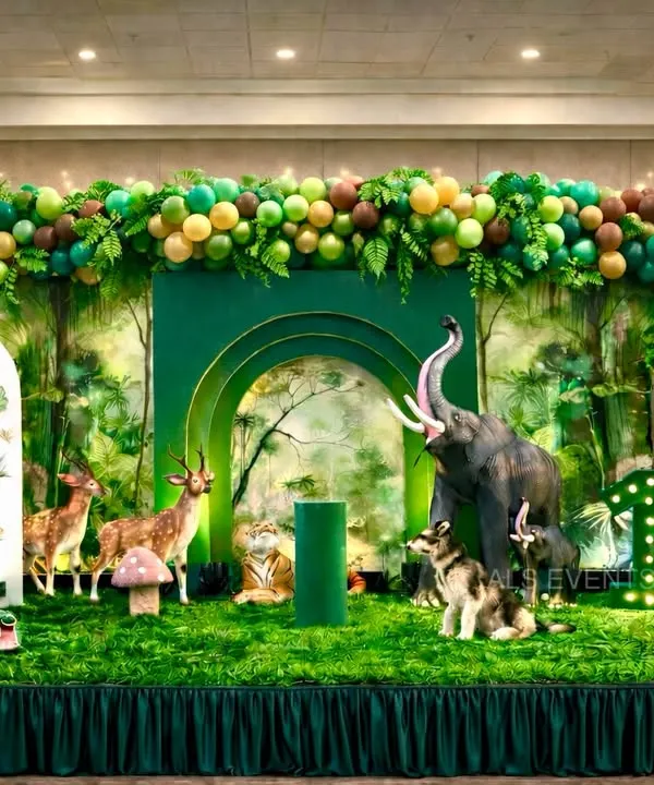 This "Wild One" jungle theme is one of our most requested setups. I use high-quality animal props, lush greenery, and layered 3D backdrops to create a truly immersive jungle experience for your child's first birthday.