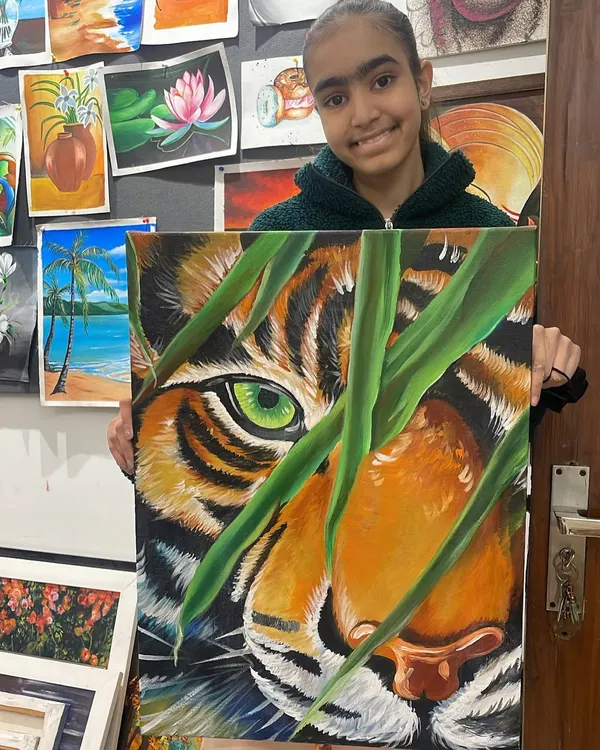 This student's incredible tiger painting shows the advanced techniques we cover, like rendering realistic fur textures and capturing the intensity of the animal's gaze.