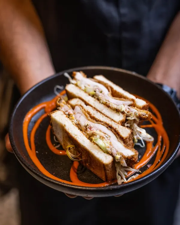 A rainy afternoon and a Buttermilk Fried Chicken Sandwich that feels like warmth itself. It takes you back to moments of sharing and laughter, all in one bite.
