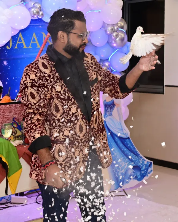 This is the moment of pure magic that I love to create. A beautiful dove appearing from a flurry of confetti is a classic illusion that never fails to bring a gasp and a smile to everyone's face, making any event truly memorable.