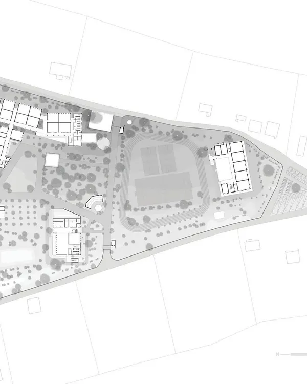 This is the proposed site plan for a new school campus near Ahmednagar. Our master plan strategically places the new primary school, a public library, and outdoor recreational areas to create a cohesive and integrated educational environment that respects the existing landscape.