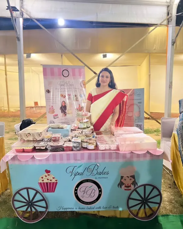 Here I am at my stall during a Durgostav and Dandiya pop-up. My little cart is filled with cupcakes, dessert jars, and other festive treats.