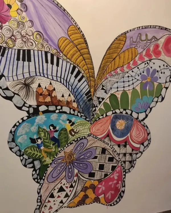 This large, hand-painted butterfly mural is a great example of our custom doodle art. We fill the design with intricate patterns, from piano keys to floral motifs, creating a unique piece of art that becomes a conversation starter.