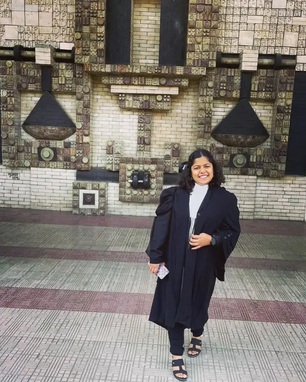 Standing outside the Delhi High Court, a place I deeply respect and admire. Wearing the advocate's gown here is a constant reminder of the profession I chose.