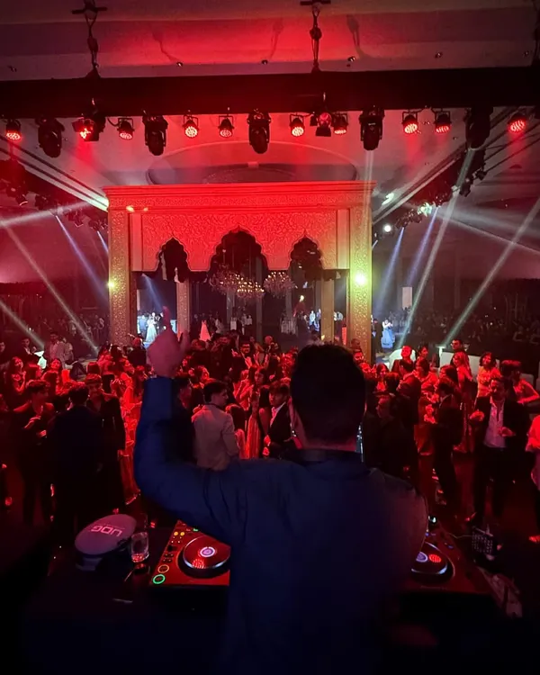 This is the result I work for. A sea of people, hands in the air, completely lost in the music. Me on the deck, crowd in check.