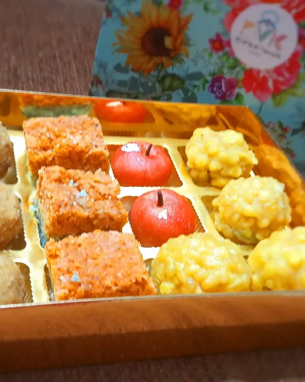 An assorted Diwali sweet box, perfect for gifting. This box features a mix of my bestsellers like Coconut Burfi, Kaju Apples, and Boondi Ladoos, all packed beautifully to share with your loved ones.