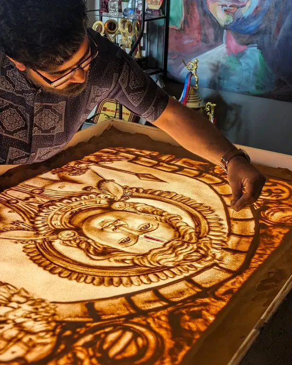 In my studio, deeply focused on creating a sand art piece of Lord Ram. Every detail is crafted with devotion. Jai Shree Ram.