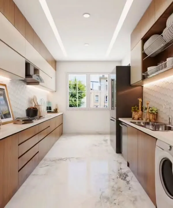 A bright and functional parallel kitchen featuring light wood cabinets and a white marble-patterned floor. This design cleverly integrates a washing machine and includes a dedicated dish-drying cabinet above the sink.