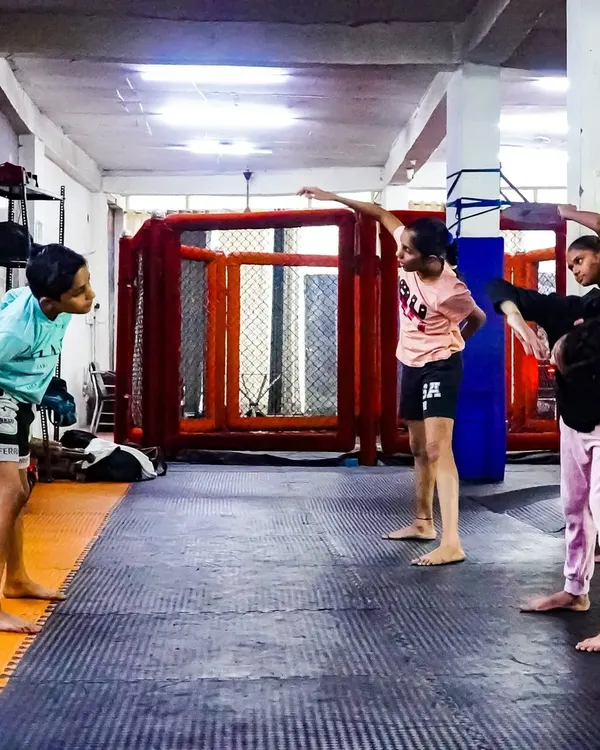 Our kids' program is not just about fighting. It's about learning discipline and coordination through structured drills. Here, young members practice their stances and movements together.