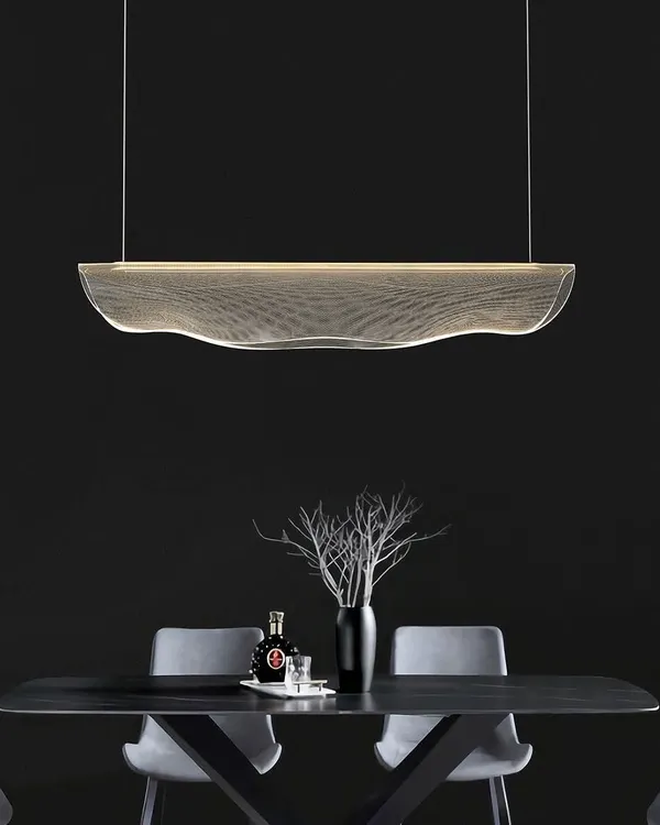This 'Waves of Elegance' linear pendant is perfect over a modern dining table. Its fluid, ribbon-like design creates a stunning visual centerpiece.