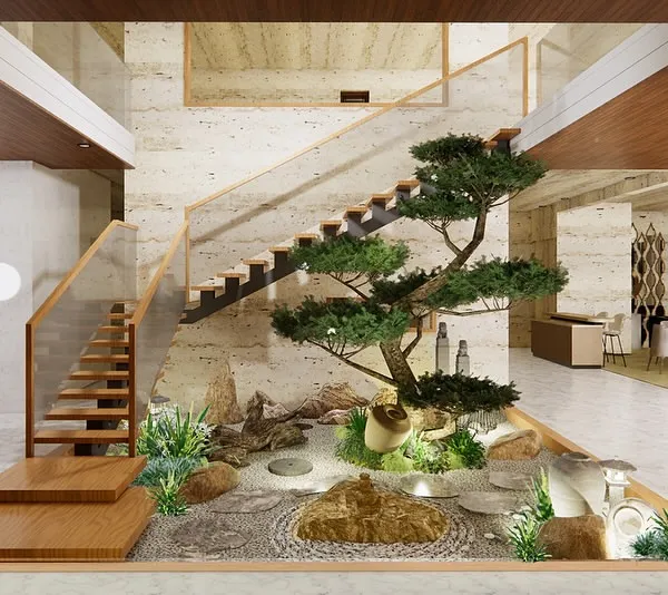 This is how we turn an overlooked area into the heart of the home. We designed this tranquil Zen garden under a staircase, creating a serene focal point with a carefully pruned bonsai, natural rock formations, and a pebble mosaic. It’s a perfect example of our indoor courtyard design service.