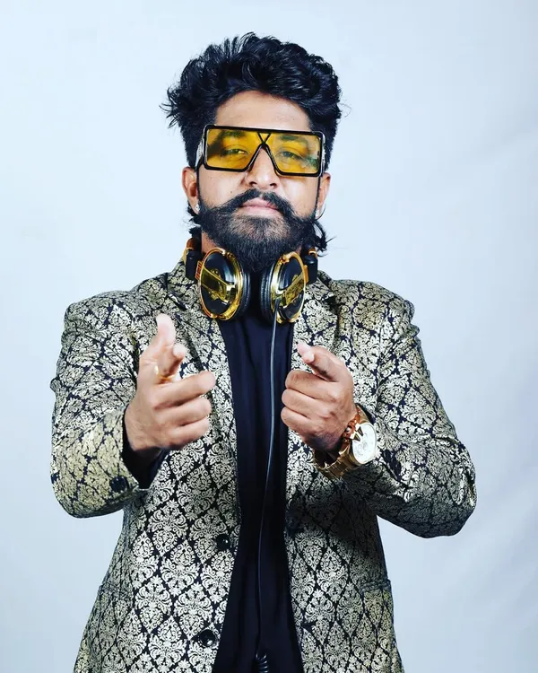 A professional portrait showing my style. I believe a DJ's presence and energy are just as important as the music they play.