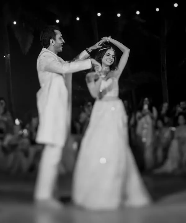 Sid and Sarah, the personification of elegance. A first dance is more than just steps; it's a conversation without words. We use light and shadow in our black and white photography to focus on the connection and the graceful flow of the moment.