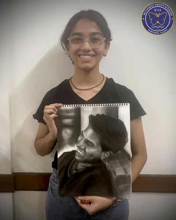 This stunningly realistic charcoal portrait, created by our student Shivani, shows the high level of skill our students can achieve. We focus on teaching techniques like shading and composition to bring our students' artistic visions to life.