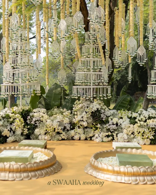 A Haldi ceremony that felt like a slow, sunlit poem. This elegant setup features delicate jasmine hangings and beds of white flowers, creating a serene and luxurious atmosphere for the ritual.