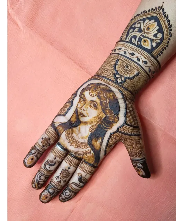 This is a perfect example of my portrait work, where I blend artistic shading with traditional henna elements. I love creating these expressive, one-of-a-kind pieces that truly stand out.