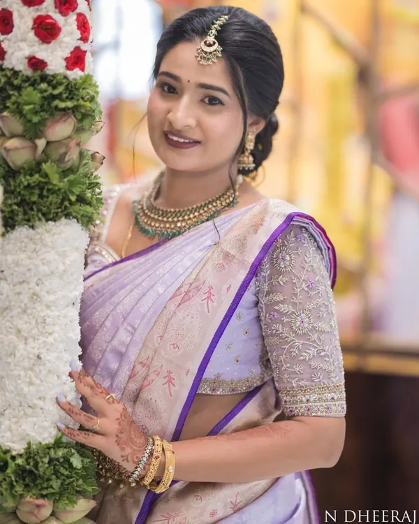 Bhavana celebrating her housewarming ceremony in a beautiful lavender Kanchivaram saree. I designed a matching blouse with intricate silver and lavender thread embroidery on the sleeves.