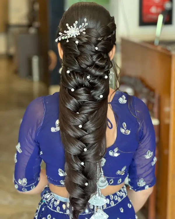 A perfect example of the Mermaid braid, adorned with pearls. This is a highly requested style that I teach in detail in my advanced workshops.