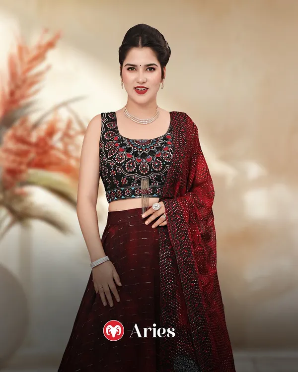 Aries, your bold and fiery energy calls for a statement look. This maroon lehenga with a detailed black blouse is the perfect match for your confident personality.