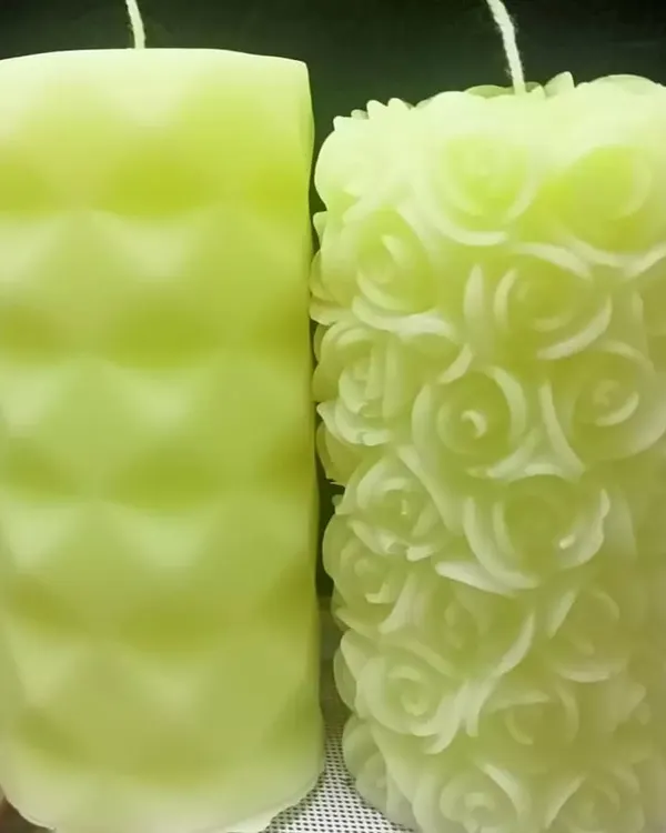 A side-by-side comparison of two of my most detailed designs: the diamond pillar and the intricate rose pillar candle, both in a soft lime green.
