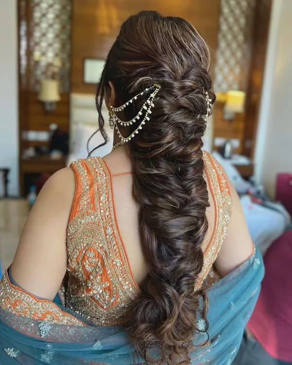 A thick, textured fishtail braid for the bride's sister. I used my human hair extensions to create this incredibly full and detailed braid, finished with a beautiful passa.