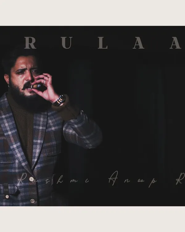For this look, we were going for a powerful, "villain style" vibe. I designed this checked blazer and paired it with a turtleneck for actor Ammith Rao. The dark, moody lighting of the shoot perfectly captures the commanding presence of the outfit.