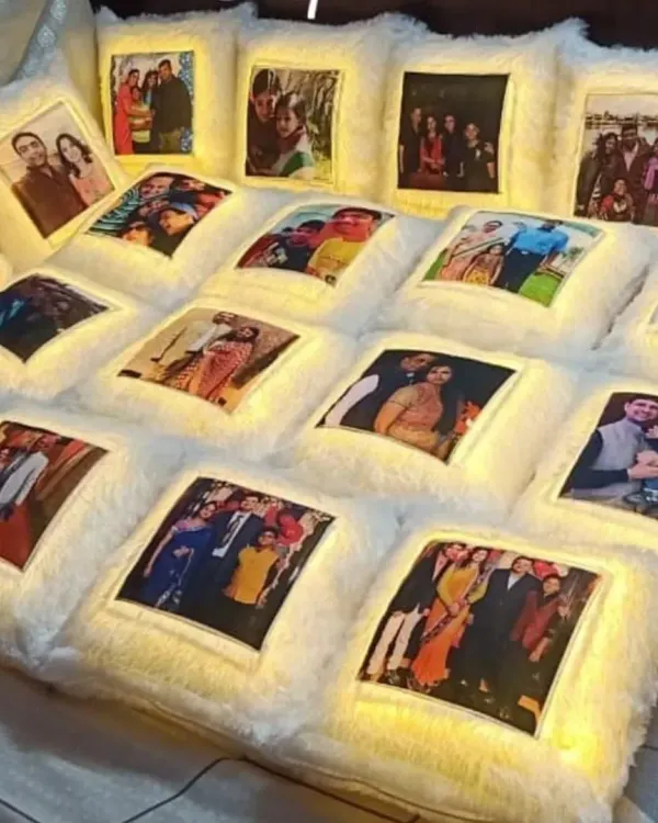 A large order of personalized LED photo cushions. These soft, furry cushions light up and can be printed with any photograph, making them a unique and heartfelt gift for personal or corporate events.