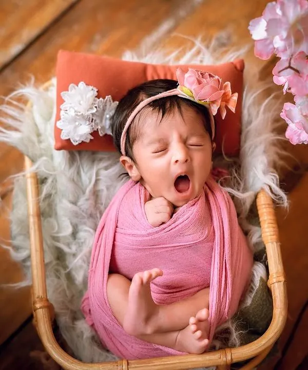 A perfectly timed yawn. These are the candid, unscripted moments that bring so much character to a newborn session.