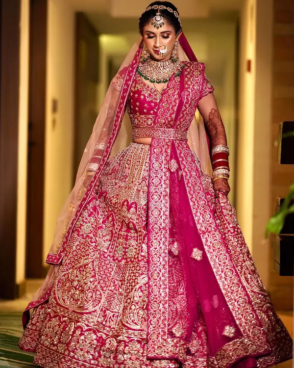 This is the ultimate bridal moment. I created a radiant and timeless look for this bride, ensuring her makeup was flawless and her hair was perfectly styled to complement her magnificent red lehenga for her wedding ceremony.