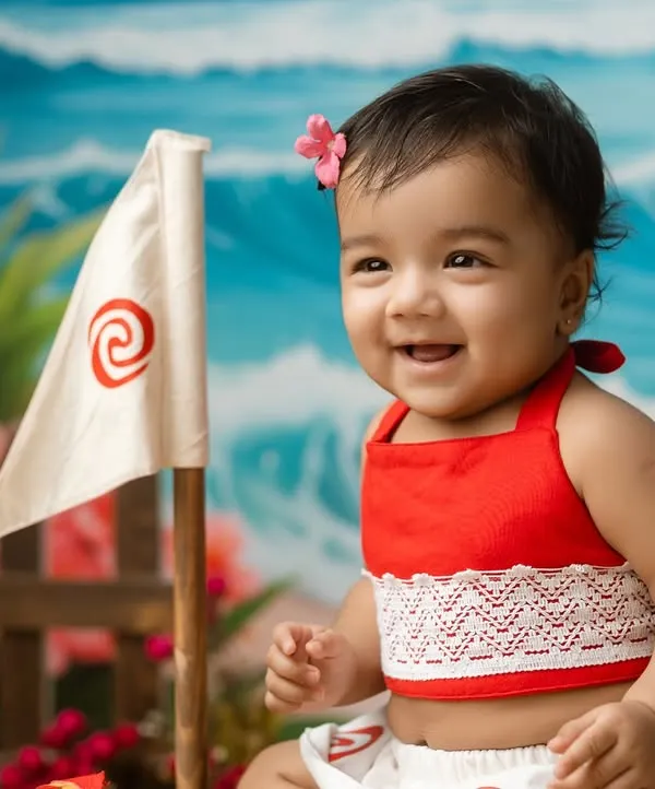 A beautiful close-up of our little Moana, her happy smile lighting up the entire frame. We focus on capturing genuine expressions of joy.